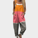 Druckoverall ärmellos: orange Oberteil, rosa Mittelteil, schwarz-weiß gestreifte Hosenbeine.