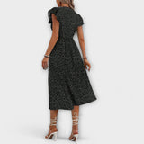 Schwarzes Midi-Kleid mit Polka-Dots, kurze Ärmel mit Volants, Rückansicht bis zum Knopfbund