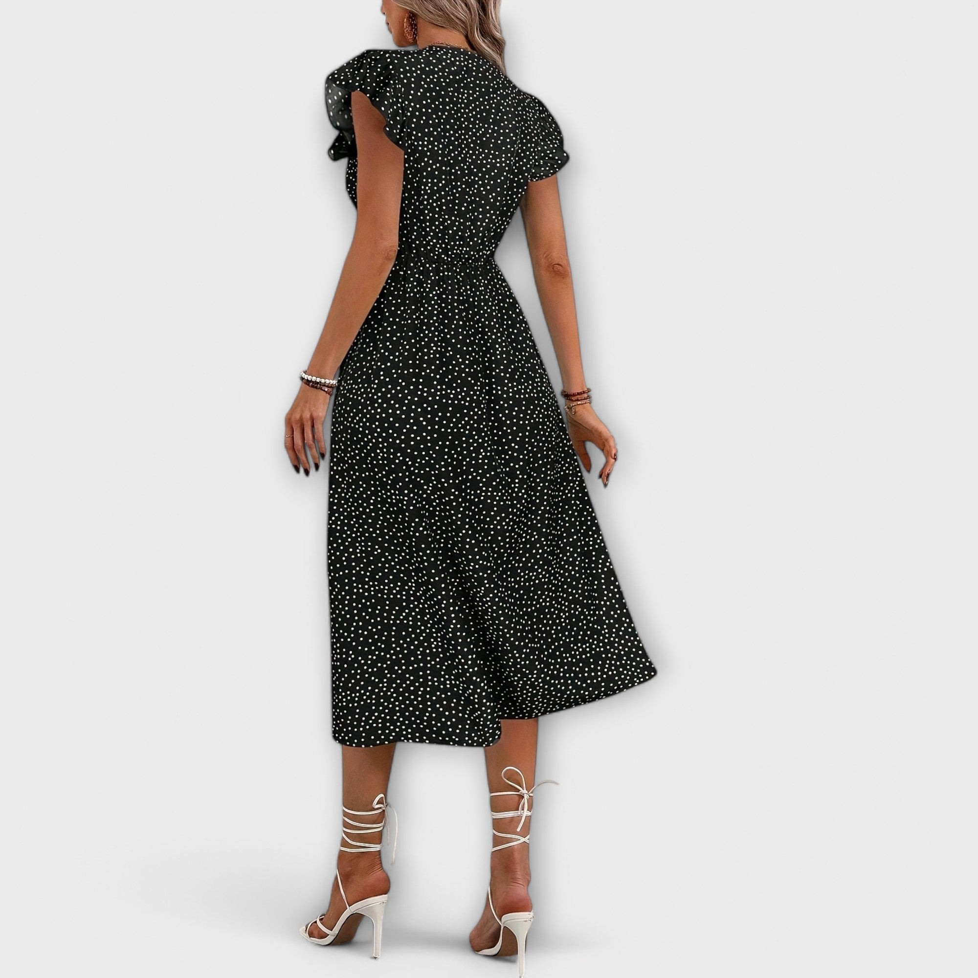 Schwarzes Midi-Kleid mit Polka-Dots, kurze Ärmel mit Volants, Rückansicht bis zum Knopfbund