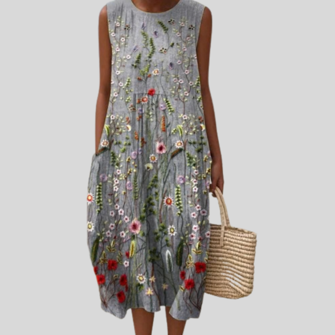 Ärmelloses Kleid mit verspieltem Blumenmuster auf dunklem Grau, lockerer Schnitt