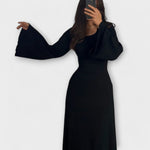 Schwarzes Strickkleid mit weitem Arm, geripptem Stoff und Taillendetail, Midilänge