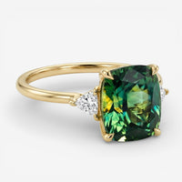 Lycka - Goldring mit grünen Zirkonia-Steinen