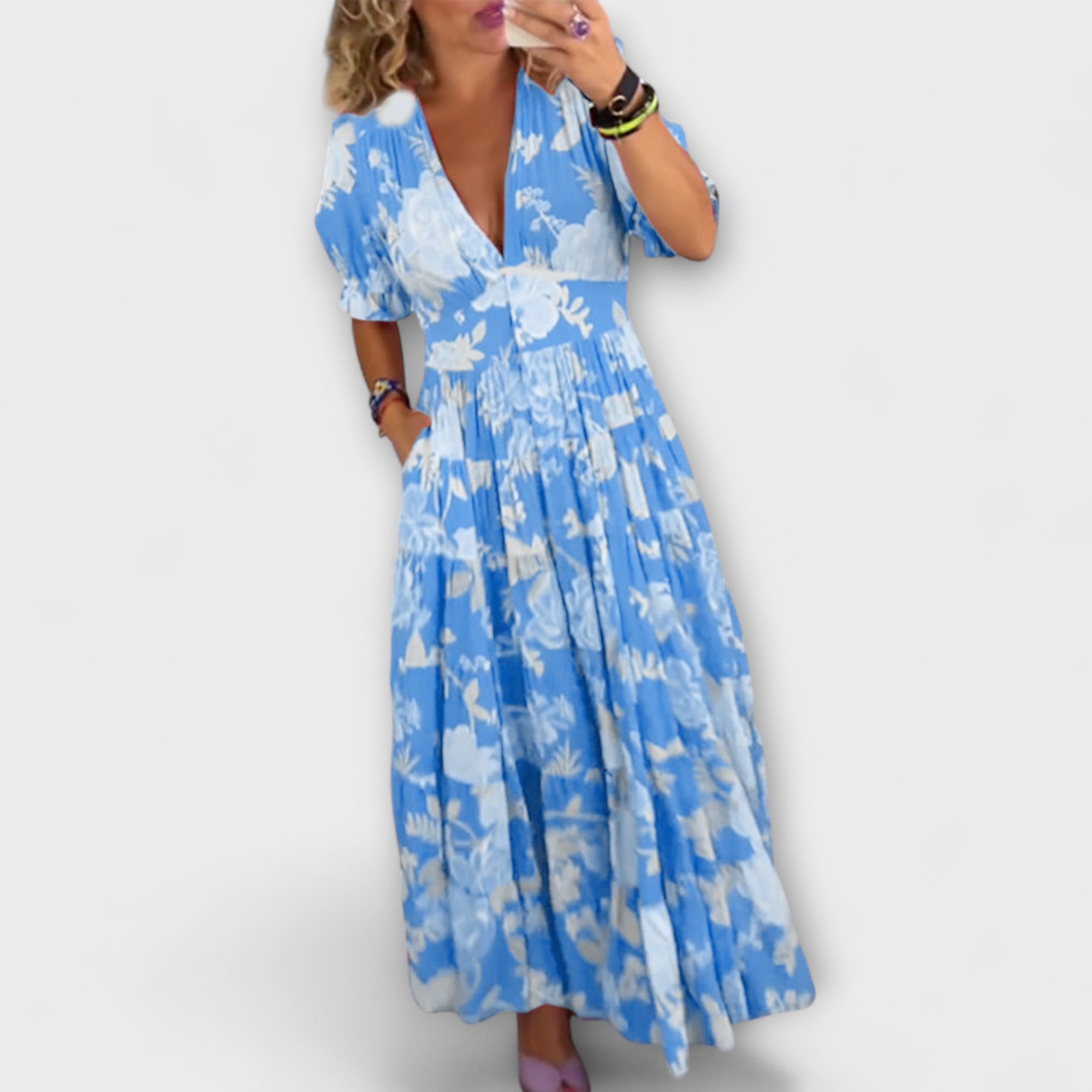 Catrisa-Blumenkleid mit V-Ausschnitt, kurzen ausgestellten Ärmeln und geraffter Taille (blau)