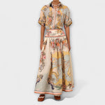 Midi-Rock mit weitem Faltenwurf, gelb-beigener Tier- und Blumenprint, Zierband am Rand.
