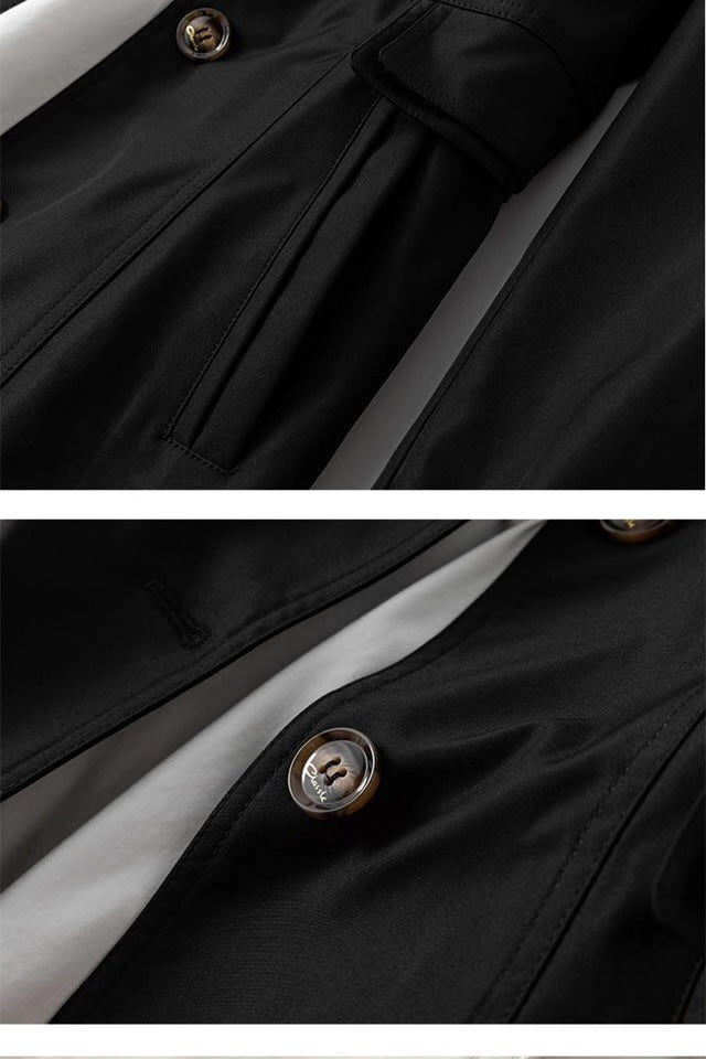 Schwarzer Windbreaker-Detail mit goldfarbener Knopfzier und Naht