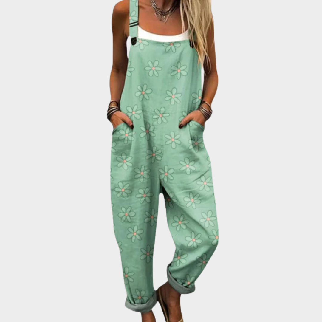 Mintgrüne Latzhose mit Gänseblümchen-Muster und Trägern vorne