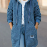 Warme Teddyweste mit Kapuze, blau, Reißverschluss und seitliche Taschen.