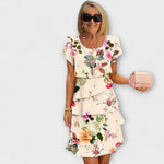 Florales Eleganzkleid mit Blumenprint, kurzer Ärmel, Volants am Saum, beige-weiß