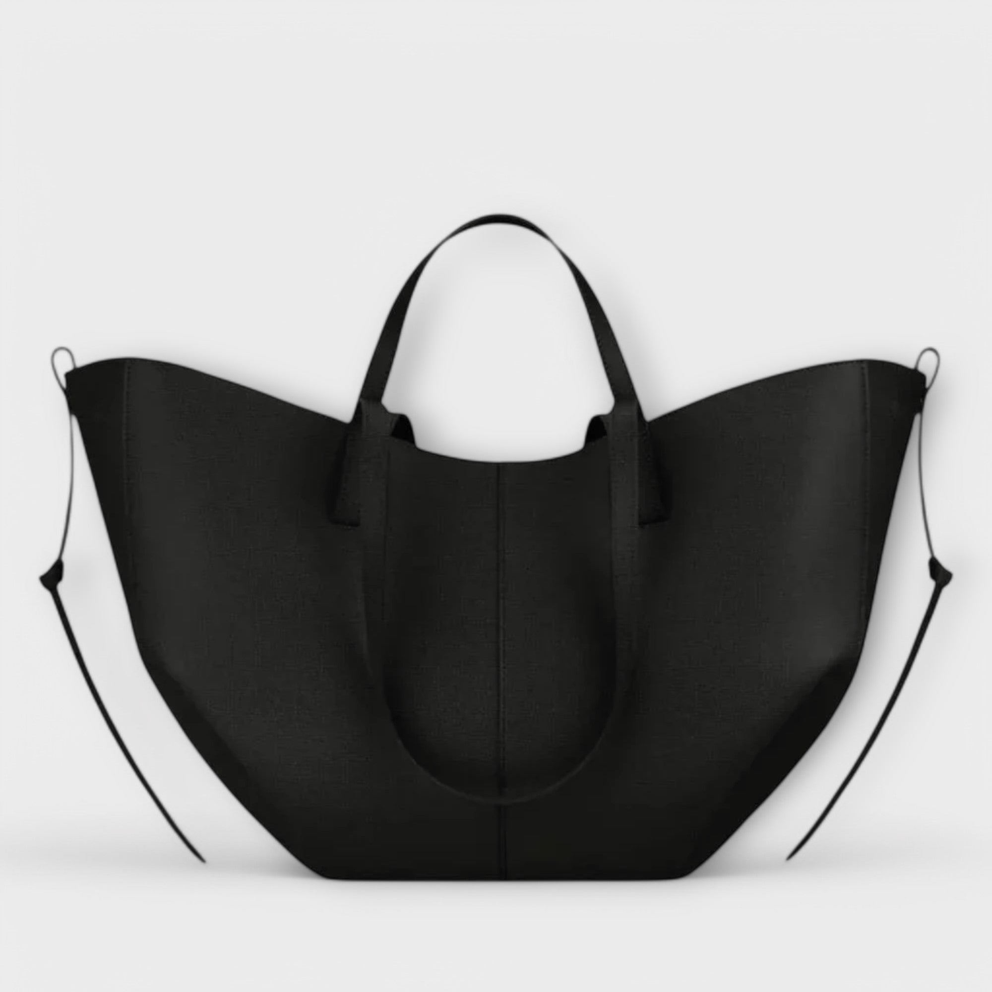 Schwarze Handtasche mit zwei Griffen, breite Form und sichtbarer Mittelnaht.