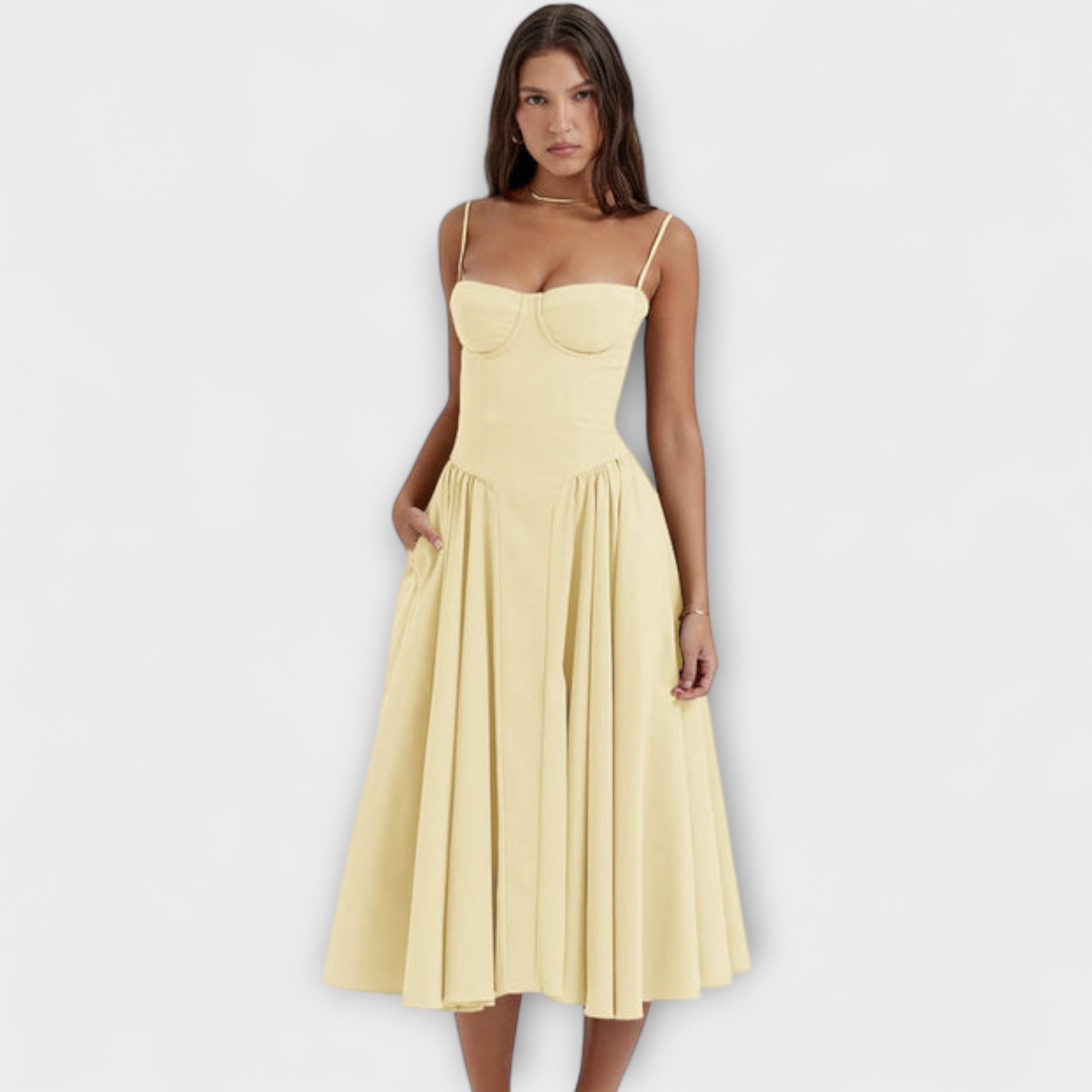 Gelbes ärmelloses Korsettkleid mit Spaghettiträgern und plissiertem Rock