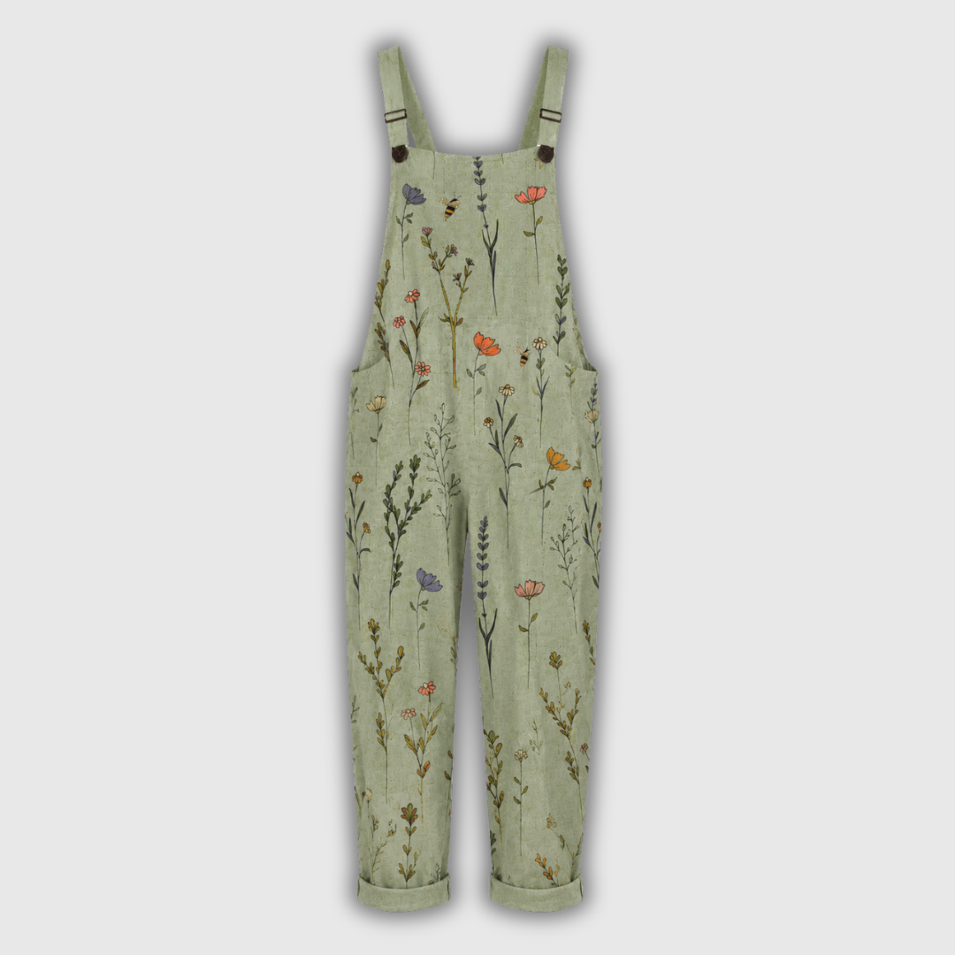 Latzhose im Vorderansicht, hellgrün mit Wildblumen-Muster, breite Träger