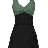 Badekleid mit Wickel-Optik oben, schwarz mit olivgrünen Trägern und Rocksaum