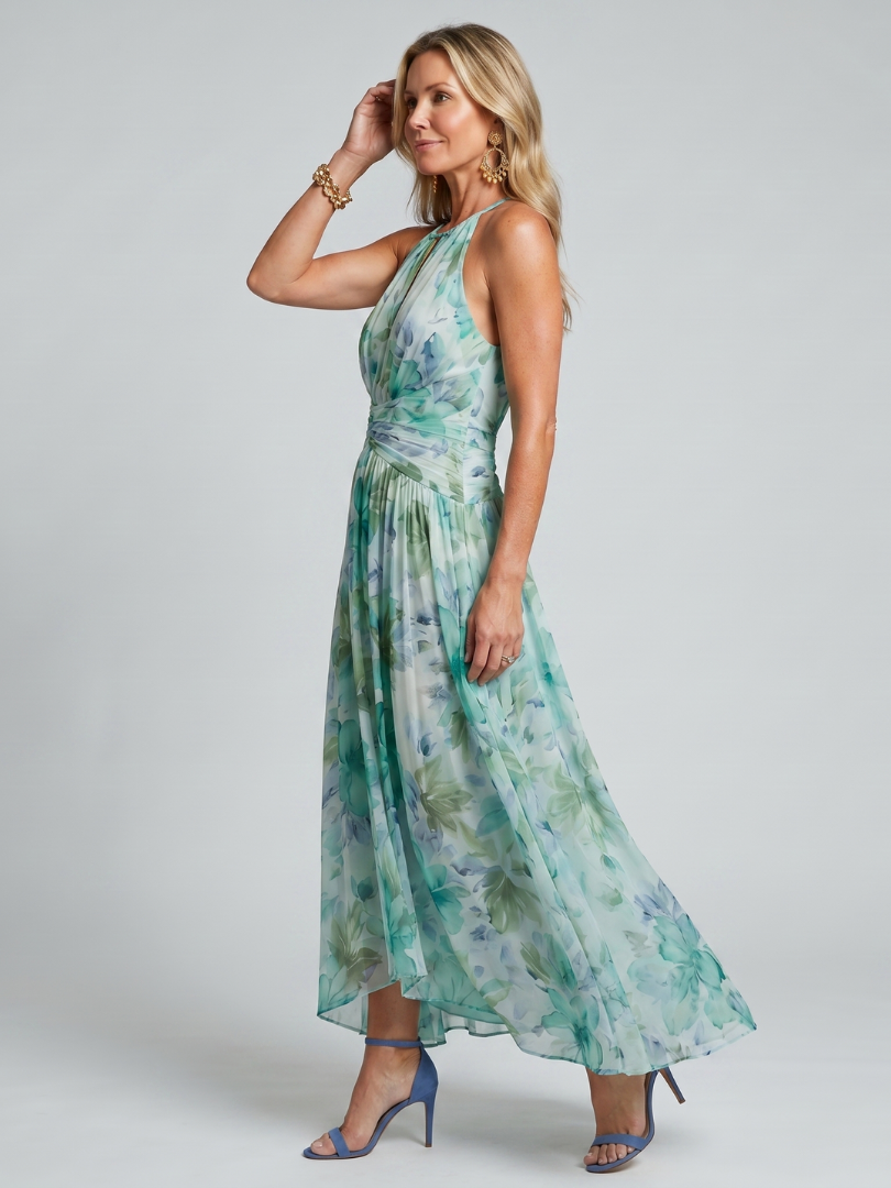 Halter-Midikleid mit grünem Blumenmuster, seitliche Ansicht, gefalteter Rocksaum