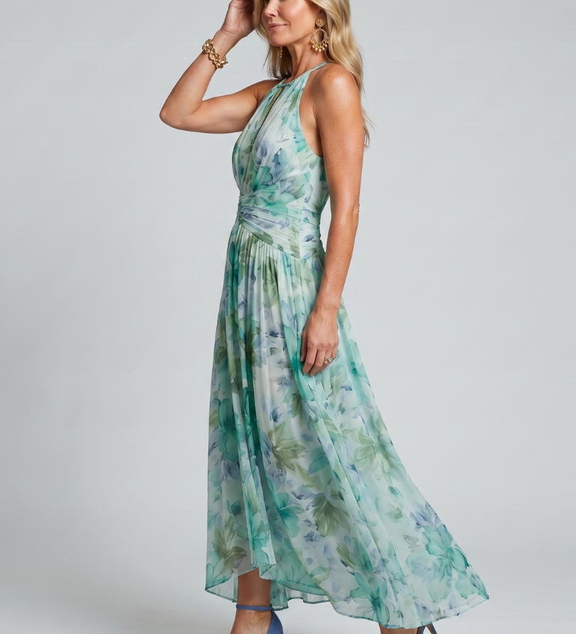 Halter-Midikleid mit grünem Blumenmuster, seitliche Ansicht, gefalteter Rocksaum