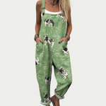 Grüner Druckoverall mit Trägern, Kuh- und Pflanzenprint, weite Beine, Fronttaschen