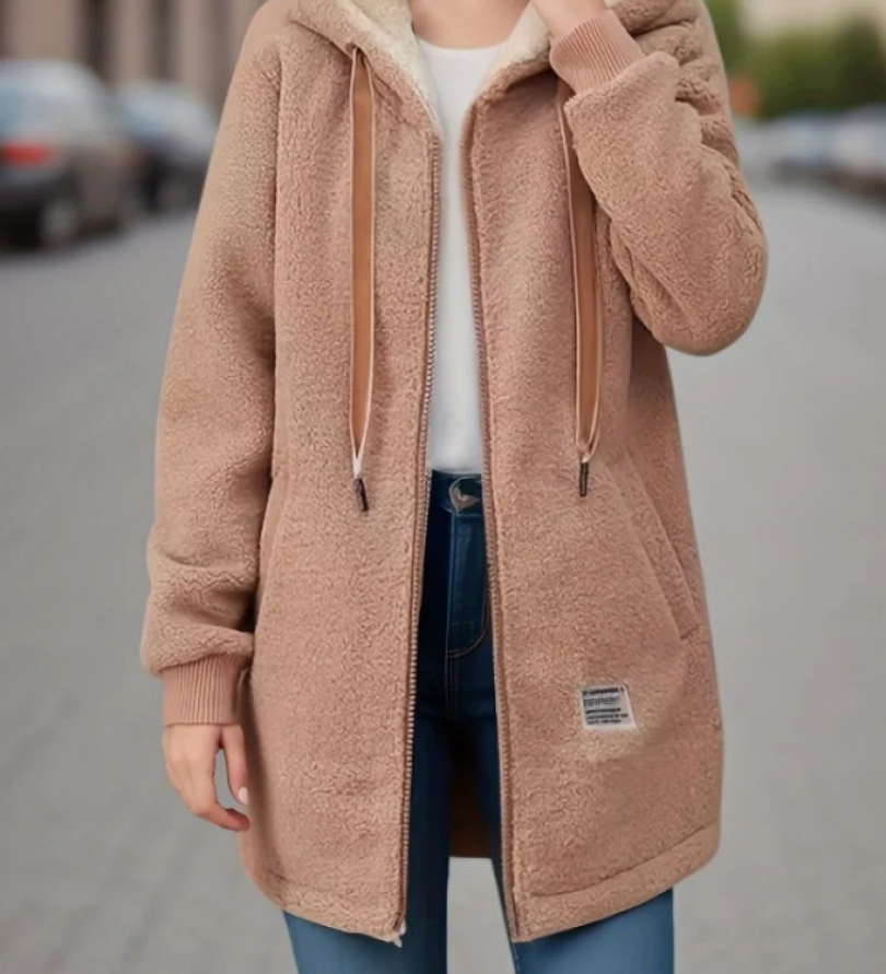 Warme Teddyweste mit Kapuze, khaki/beige, Reißverschluss und seitliche Taschen.