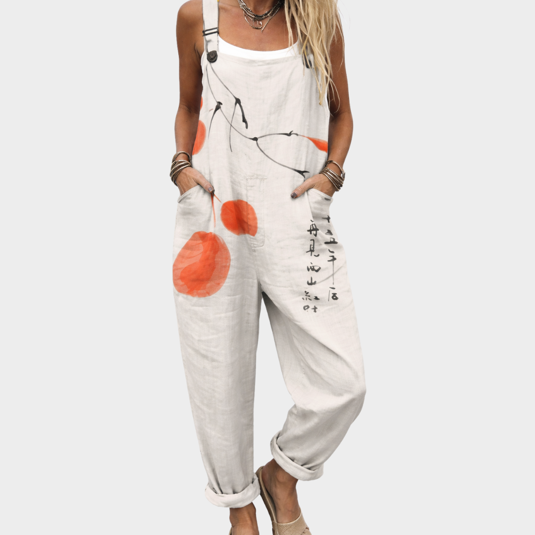 Latzhose mit Aquarell-Punkten in Weiß und Orange, locker geschnitten