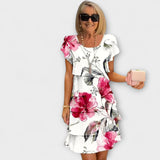 Florales Eleganzkleid in Weiß mit großen pinken Blumen, kurze Ärmel, Volantrock