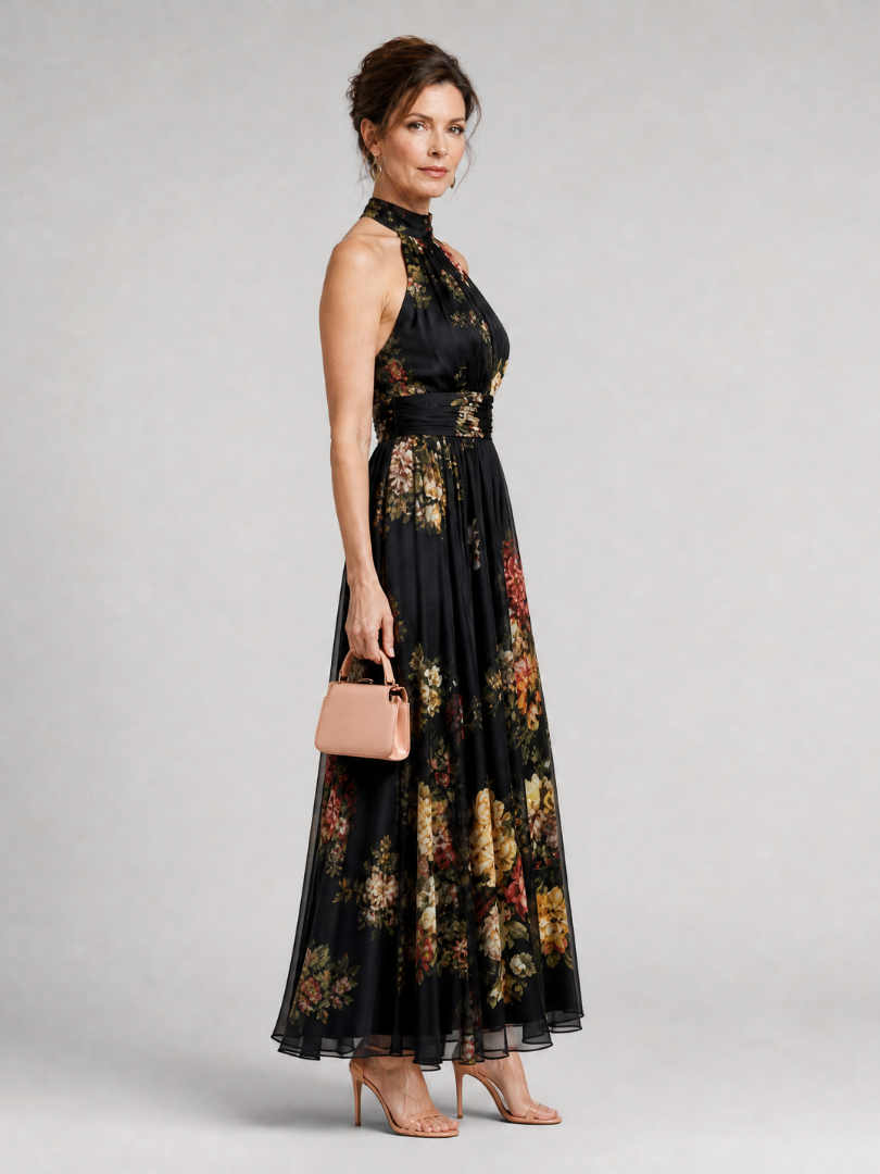 Schwarzes Halter-Neck Midi-Kleid mit floralen Prints, seitliche Ansicht, weiter Rock