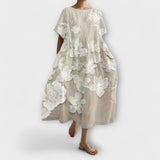 Beiges elegantes Kleid mit weißem Blumenmuster, kurzen Ärmeln und weitem Rock