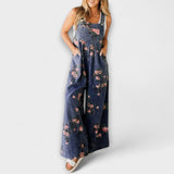 Jeans-Latzhose mit weitem Schnitt, dunkelblauem Denim und rosafarbenem Blumenprint