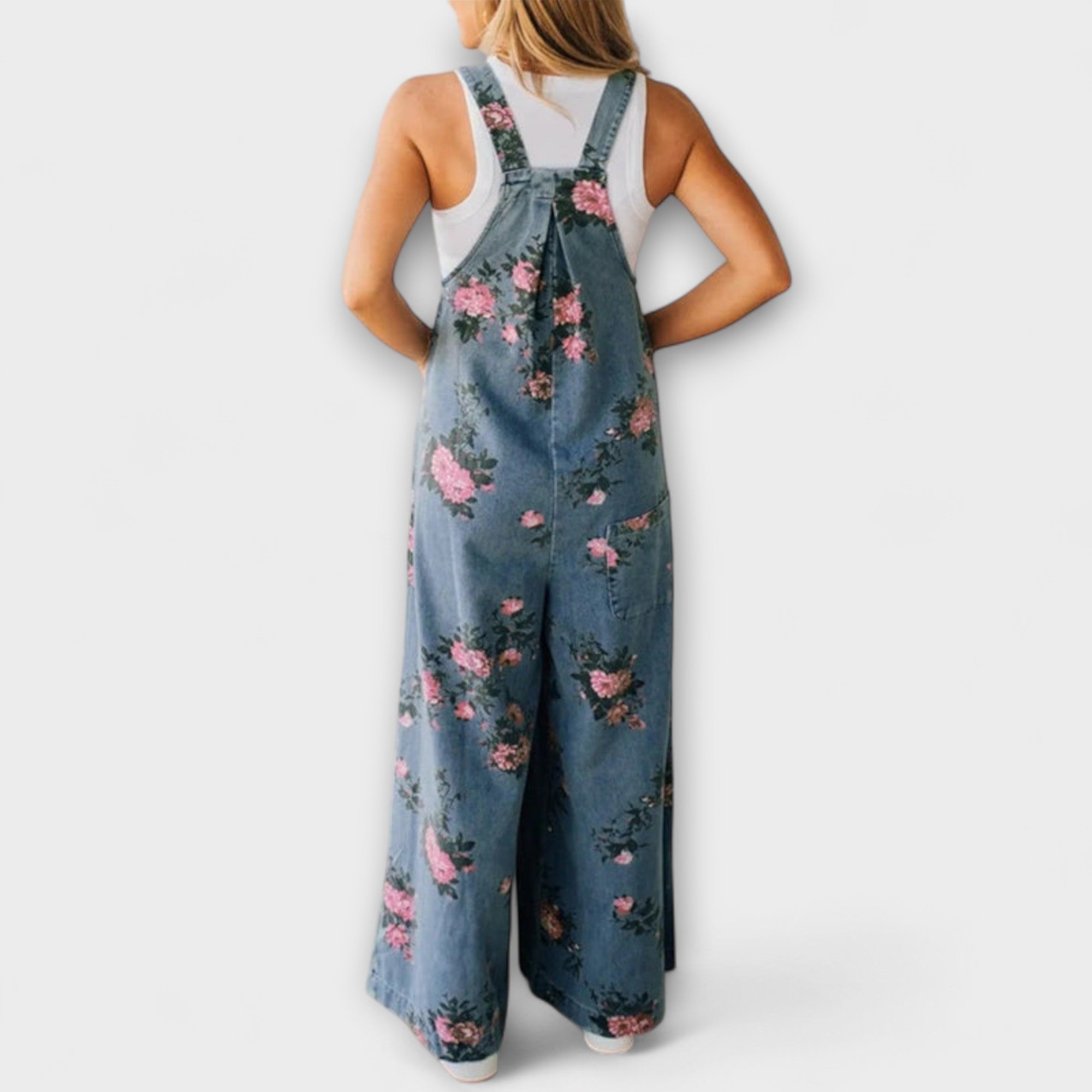 Jeans-Latzhose mit verstellbaren Trägern, blauem Denim und großem Blumenmuster