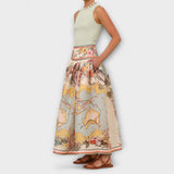Midi-Rock mit Faltenwurf und ausgestelltem Schnitt, gelb-beige mit farbigem Paisley-Print.