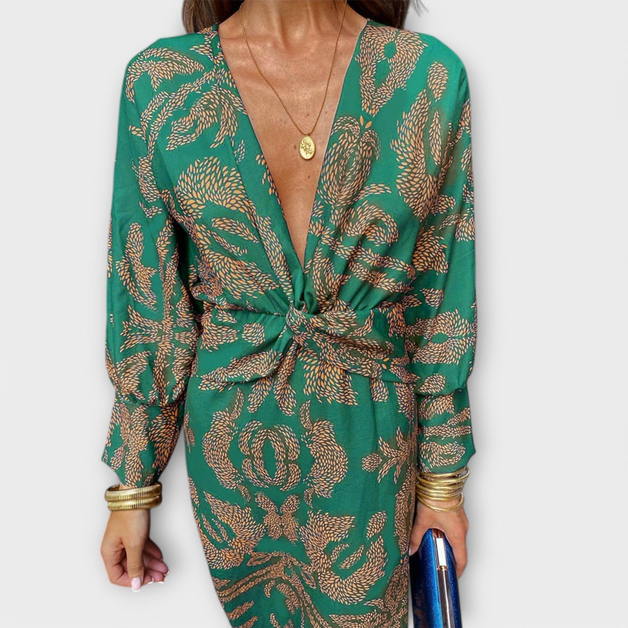Elegantes Kleid mit langen Ärmeln, grün mit goldfarbenem Paisley-Muster, geknotete Front