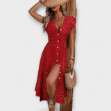 Rotes Midi-Kleid mit weißen Polka-Dots, V-Ausschnitt, Knopfleiste, Kap-Ärmeln und vorderem Schlitz