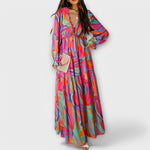 Elegantes Kleid mit V-Ausschnitt, langen Ärmeln und mehrfarbigem Muster, weite Rockform
