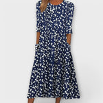 Elegantes Blumenkleid dunkelblau mit weißem Blümchenmuster, ausgestellter Rock