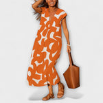 Leichtes Kleid mit V-Ausschnitt, ärmellos, orangefarbenes Allover-Muster, knielang