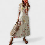 Damen-Sommerkleid mit floraler Musterung, fließende Silhouette, kurze Ärmel