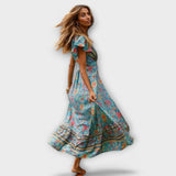 Shylin Boho-Maxikleid mit Blumenprint, V-Ausschnitt, kurzen Ärmeln, Volants und Beinschlitz.