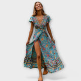 Shylin Boho-Maxikleid, floraler Türkis-Look, Wickeloptik mit Schlitz, geraffter Rocksaum.
