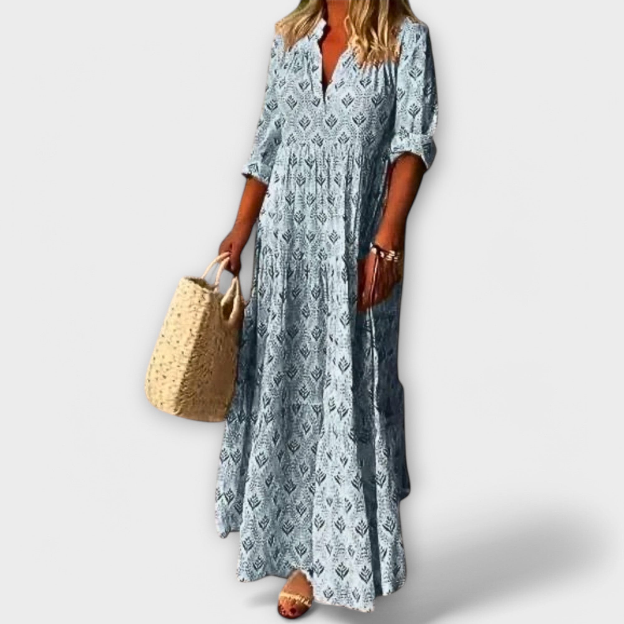 Blaues Maxikleid mit V-Ausschnitt, Knopfleiste und Allover-Muster, locker fallend