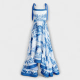 Maxikleid aufrecht abgebildet: Träger mit Schleifen, blau-weißes Muster, Volant-Saum