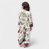 Maxikleid Rückansicht mit floralen Print, langen Ärmeln und Saumstreifen in Grün/Rot