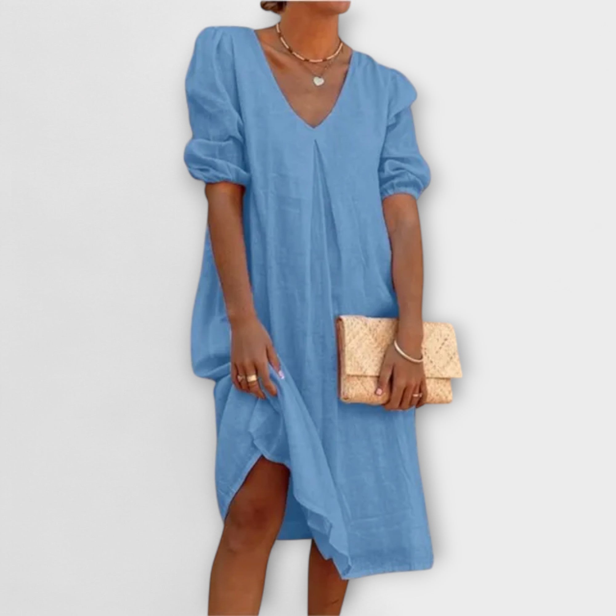 Blaues Sommerkleid mit V-Ausschnitt und lockeren Puffärmeln, knielang, weiter Saum