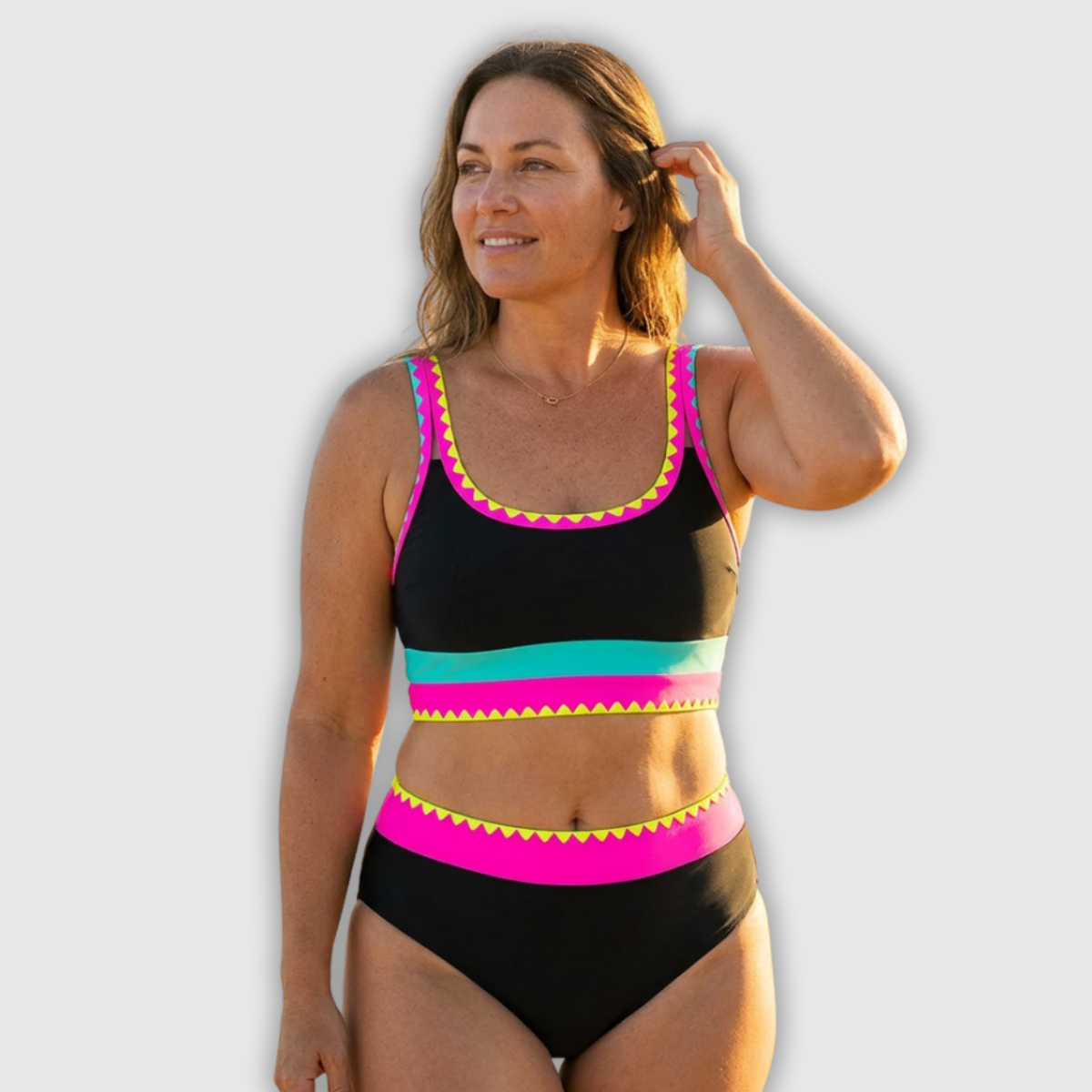 Bauchfreier Bikini-Set, schwarz mit pinken, türkisfarbenen und gelben Streifen