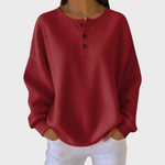 Roter Pullover aus Waffelstrick mit Knopfleiste am Halsausschnitt