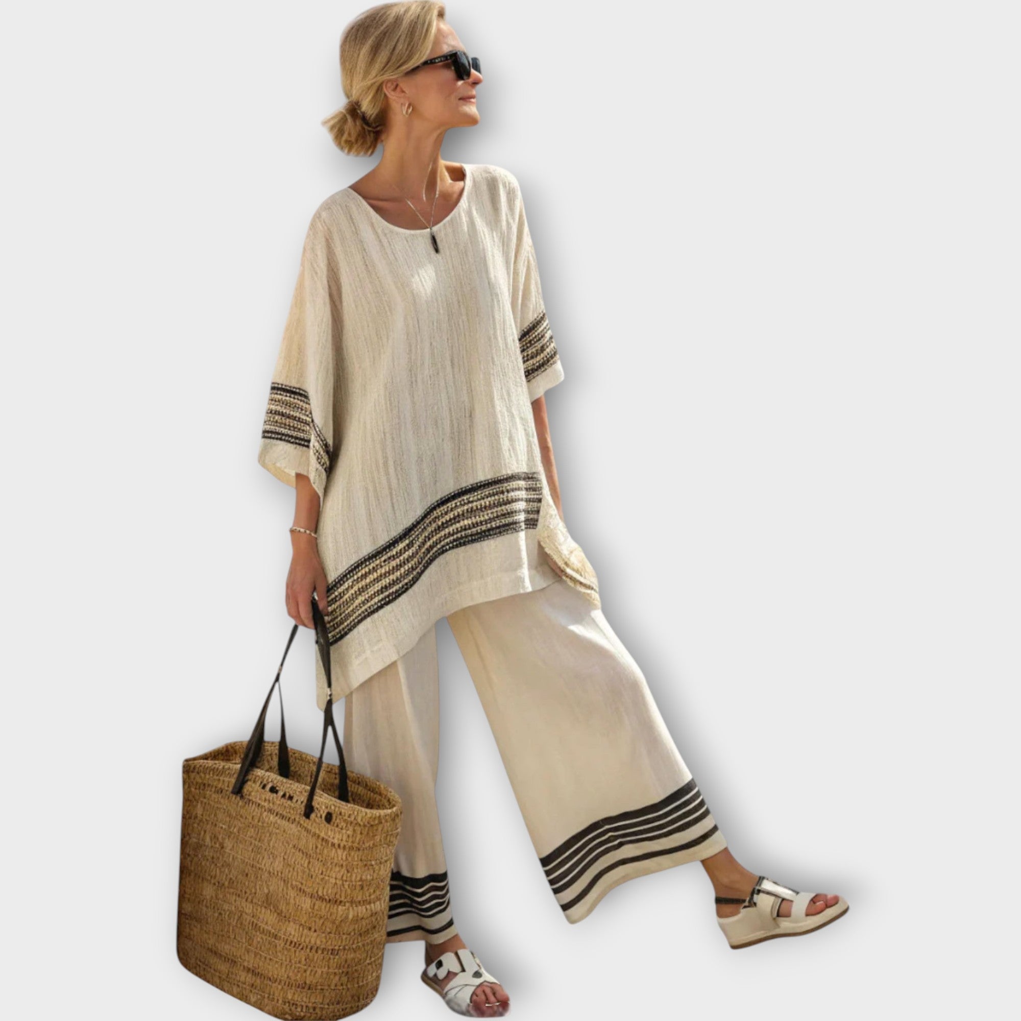 Zweiteiliges Set: beigefarbenes Oversize-Oberteil mit schwarzen Streifen, weite Hose