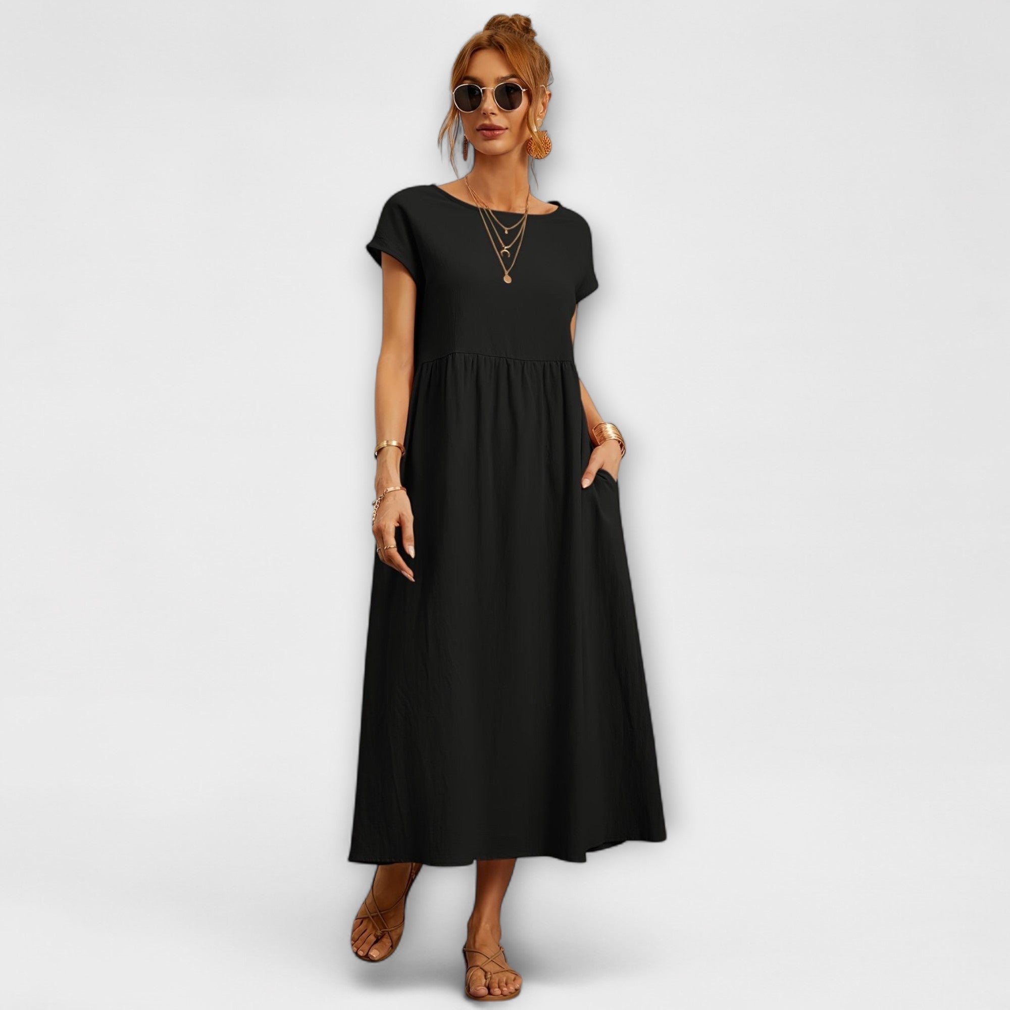 Schwarzes Kleid mit kurzen Ärmeln, Rundhalsausschnitt und gerafftem Faltenrock
