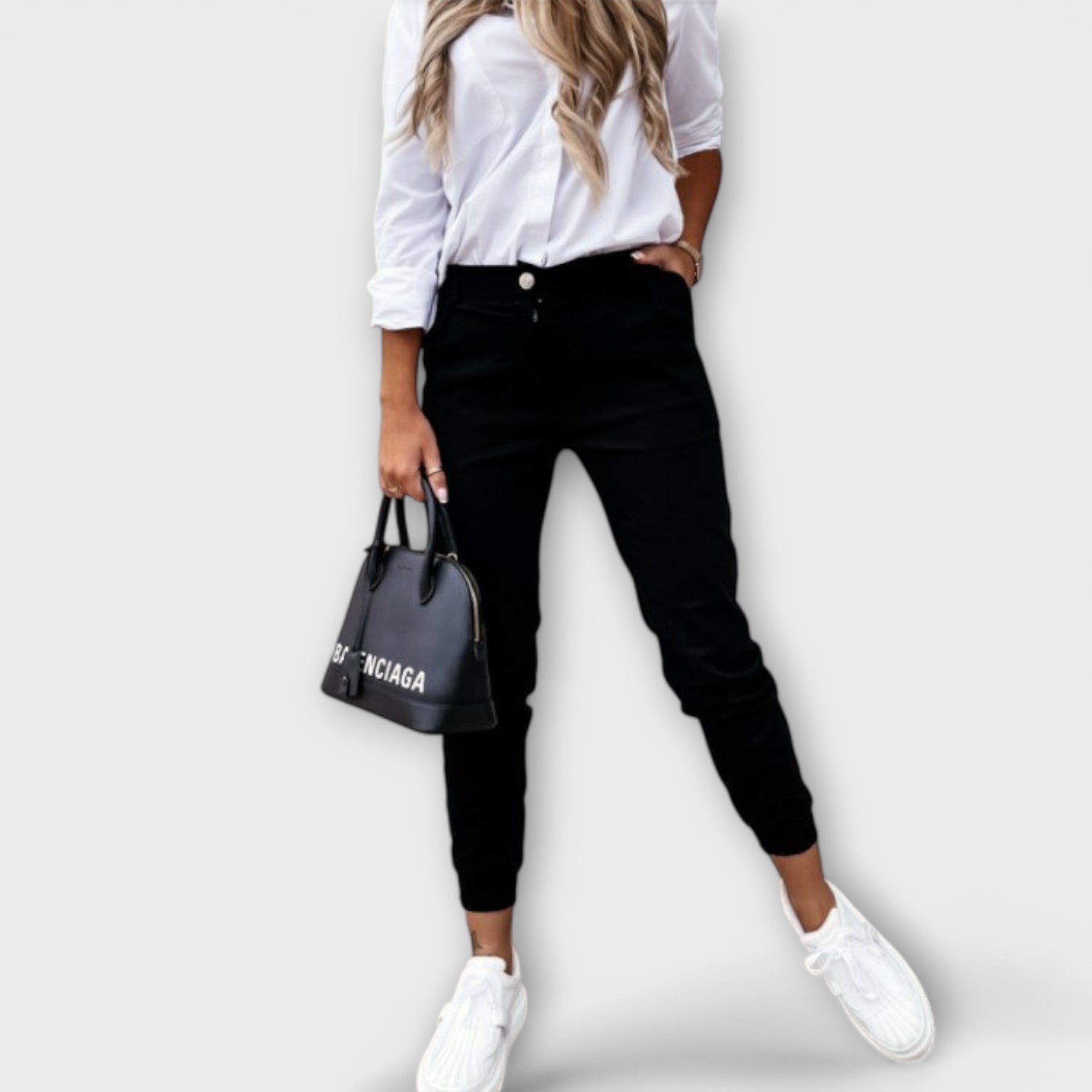 Schwarze Stretchhose mit Knopfverschluss, schmal zulaufend und Knöchel-Bündchen