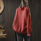 Roter Grobstrick-Pullover mit Stehkragen und geripptem Ärmelbündchen