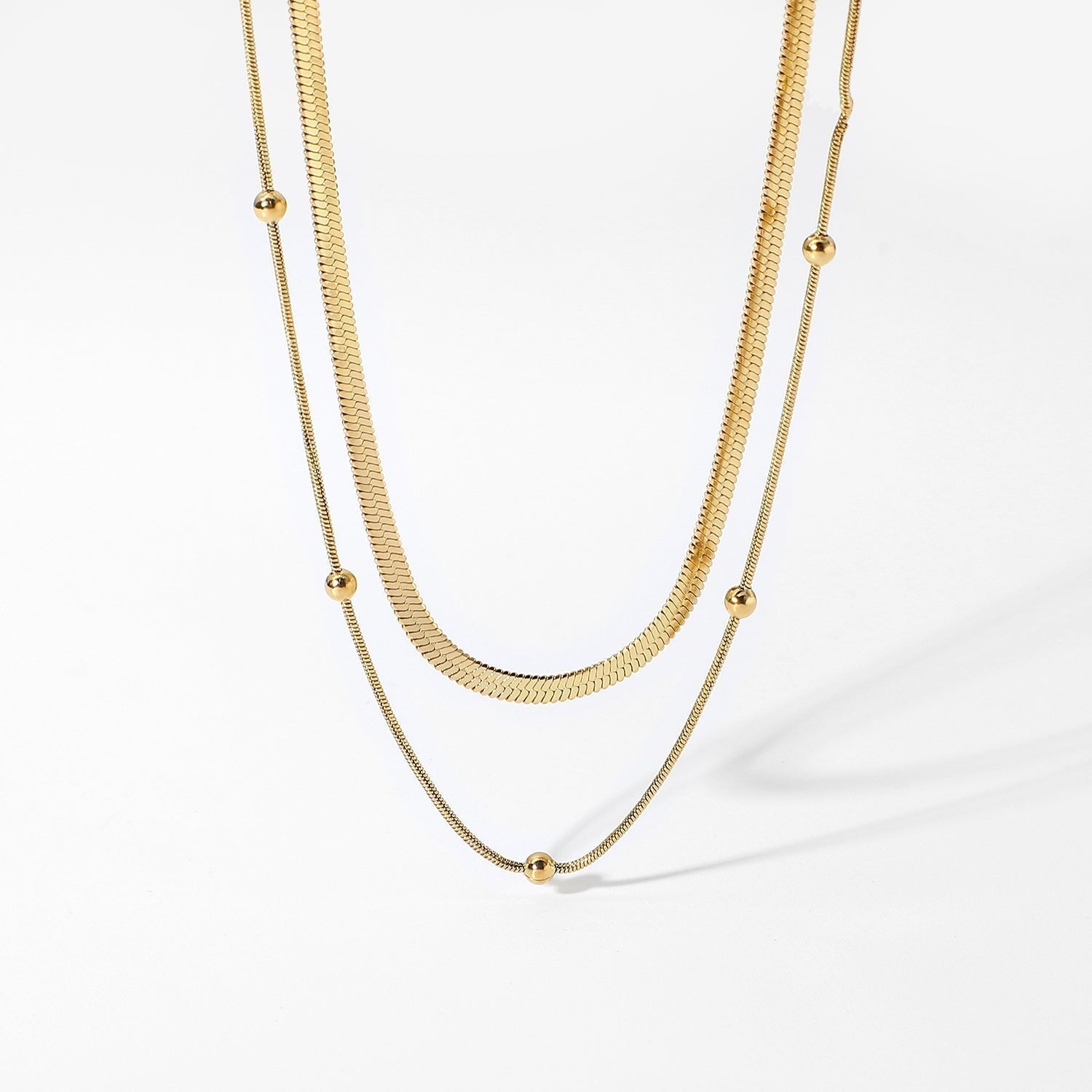 Zweireihige Goldkette mit feiner Gliederkette und runden Kugel-Details