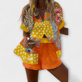 Elegantes Kurz-Set: kurzes Oberteil und Shorts, gelb/orange mit gepunktetem Muster