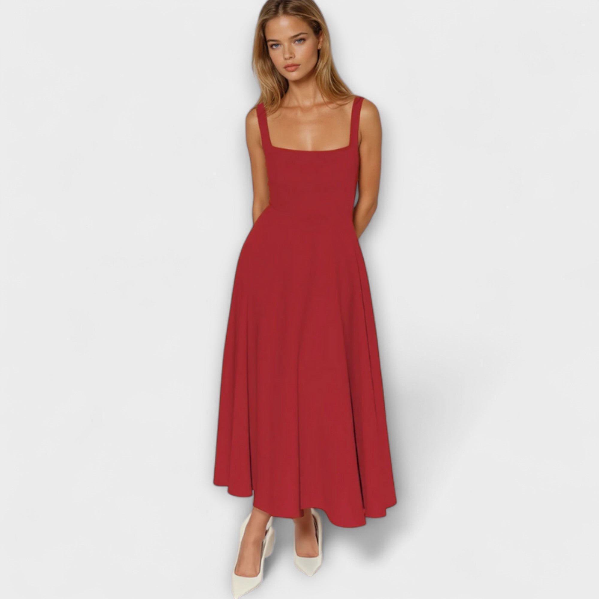 Rotes Abendkleid mit schmalen Trägern, eckigem Ausschnitt und weit fallendem Midirock