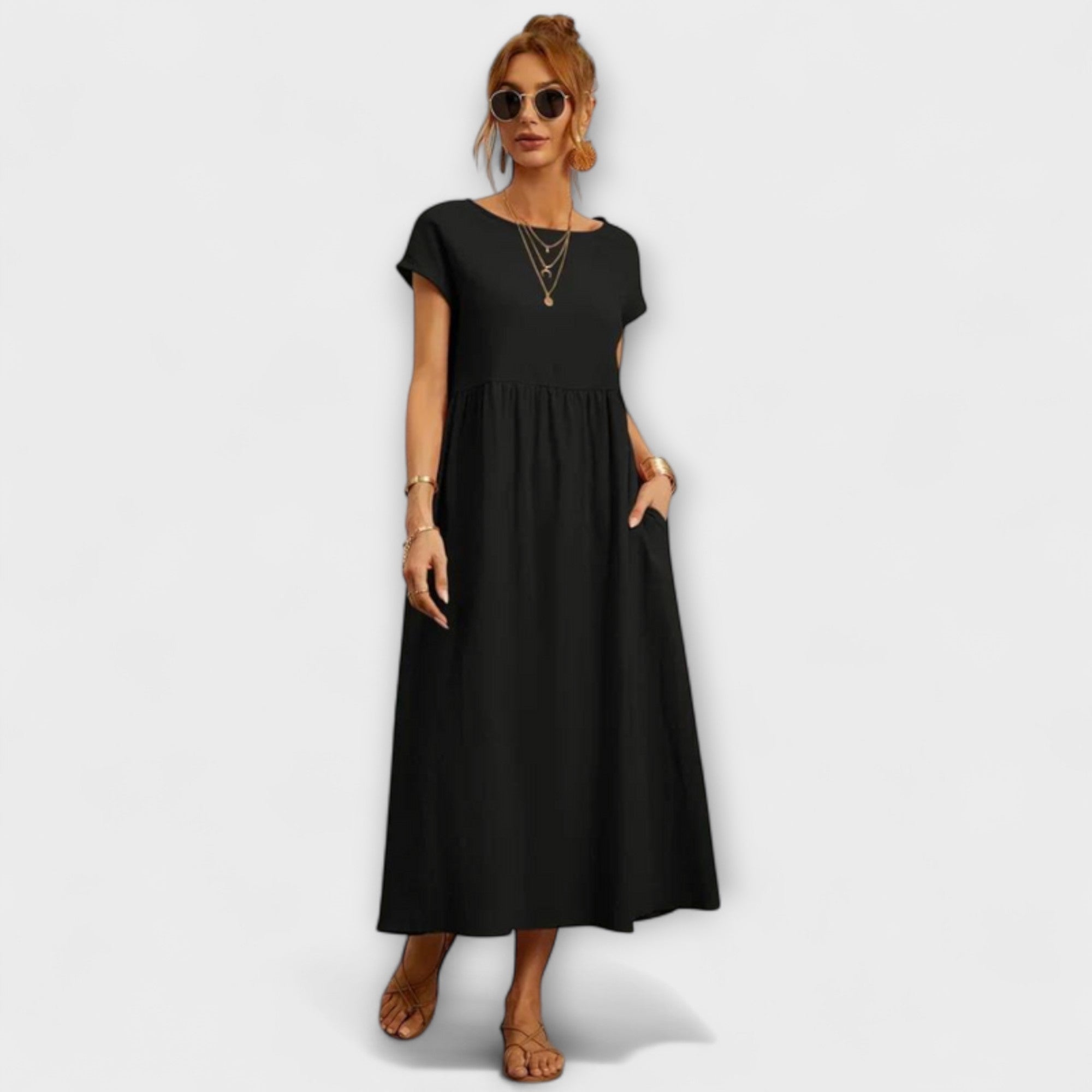 Leichtes Sommerkleid in Schwarz mit kurzen Ärmeln und Taschen, locker fallender Schnitt
