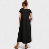 Sommerkleid Schwarz mit kurzen Ärmeln und Taschen, Rückansicht mit gerafftem Rock
